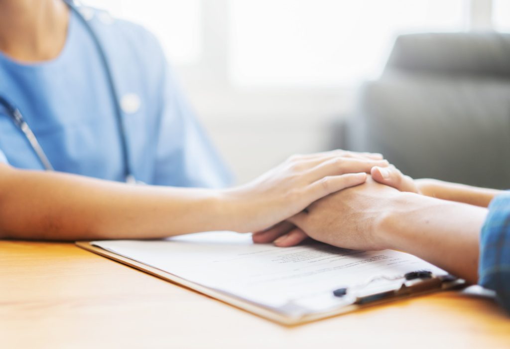 Hands holding over the document